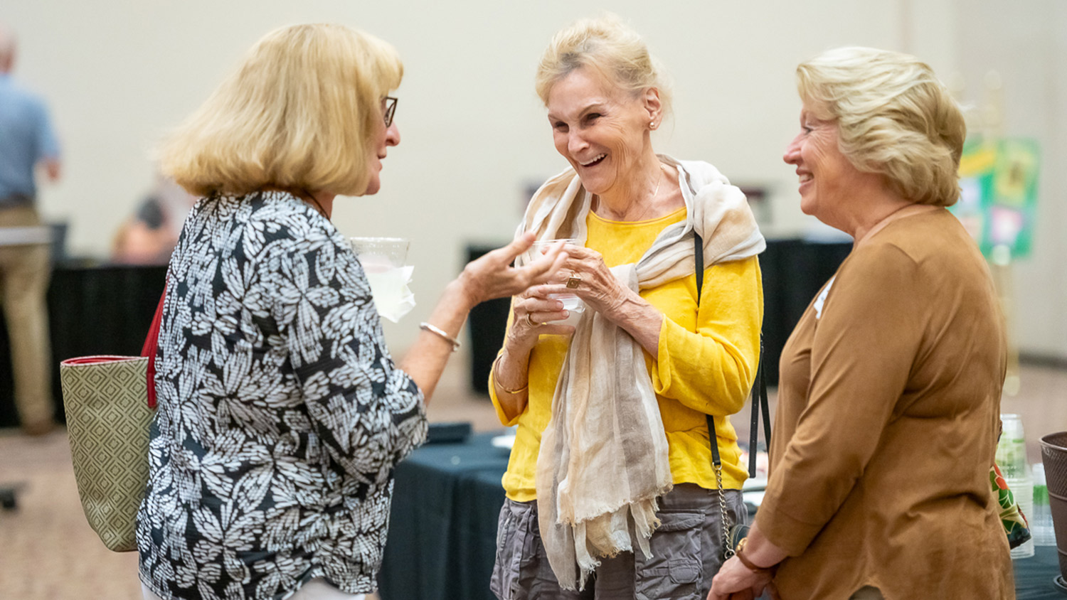 Group of female OLLI members having a discussion at the McKimmon Center in Oct. 2024