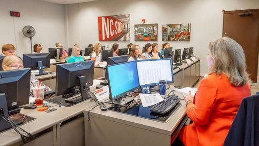 an instructor leads and excel class