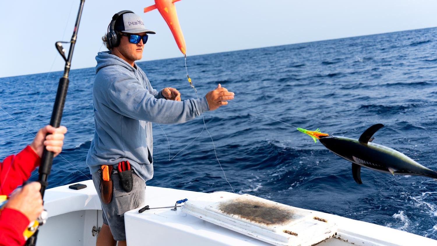 Sport Fishing School - June 2025 - instructor dropping a large lure